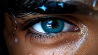Close up macro shot of bright blue eye with long eyelashes and dark skin, showing intricate iris details and natural reflections. Artistic beauty photography.