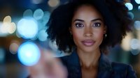 Professional African American businesswoman with curly hair against blurred city lights background at night for corporate marketing materials.