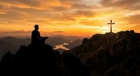 Man silhouette sitting on mountain peak contemplating cross at golden sunrise over valley landscape for spiritual meditation and faith concepts.