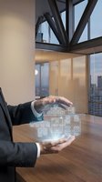 Businessman hands protecting holographic digital network diagram in modern office with city skyline view representing cybersecurity and data protection concepts.