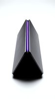 Sleek gray and black speaker with purple LED accent lighting, isolated on white background for tech product design and electronics marketing use.