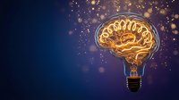 Glowing brain lightbulb with golden neural networks on dark blue background with sparkling particles for creativity and innovation concepts.