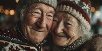 Elderly couple embracing warmly in winter clothing with cozy knitted hats and scarves, showing love and companionship in golden bokeh light atmosphere.