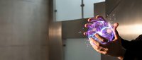 Businessman holding glowing digital brain with neural networks and sparks in modern office environment representing artificial intelligence and innovation.