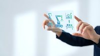 Business professional using tablet with digital commerce icons including shopping cart and analytics charts for online retail strategy.