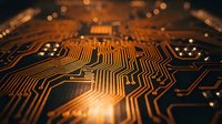 Close-up macro view of orange illuminated circuit board with glowing electronic pathways and components. Technology hardware background for digital concepts.