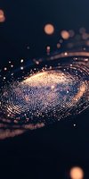 Glowing spiral pattern of light dots against dark background creates mesmerizing abstract composition with bokeh effect and golden illumination.
