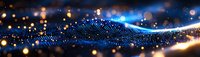 Glowing blue digital wave with golden particles flowing on dark background creates futuristic technology landscape for business and science concepts.
