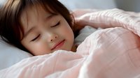 Young Asian woman sleeping peacefully in bed with soft pink bedding, natural morning light creating serene atmosphere for wellness and lifestyle concepts.