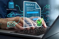 Digital invoice management system with hands typing on laptop showing automated billing verification and tax compliance features for business.