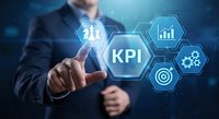 Professional businessman touching KPI key performance indicator interface with digital hexagonal icons showing analytics charts and target metrics.