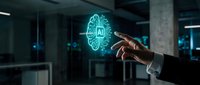Businessman hand touching glowing AI artificial intelligence hologram icon in modern office environment for technology innovation and digital transformation.