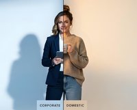 Young businesswoman showing work-life balance concept with corporate suit and casual sweater outfit transformation for lifestyle branding.