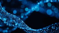 Abstract blue glittering wave with sparkling particles and bokeh lights on dark background for luxury design projects and digital art compositions.