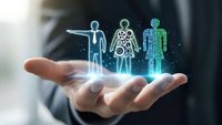 Businessman hand holding holographic human body anatomy figures with glowing medical icons for healthcare technology and digital medicine concepts.