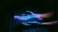 Gloved hands holding glowing DNA double helix strand with blue and purple light effects on dark background for genetic research and biotechnology concepts.
