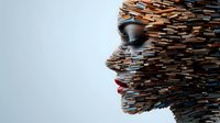 Profile silhouette formed by layered wooden pieces against light background, showing artistic interpretation of human consciousness and identity.
