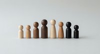 Wooden peg people figures in various skin tones representing diversity and inclusion concepts for business teamwork and social equality presentations.