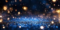 Magical glowing bokeh lights on dark blue background with golden sparkles and shimmering glitter creating dreamy festive atmosphere for holiday designs.