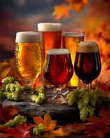 Assortment of craft beer glasses with varying colors from light golden to dark stout, surrounded by autumn leaves and fresh hops on stone surface.