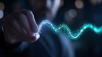 Glowing blue and green energy wave flows from finger touch against dark background, creating magical light trail effect with bokeh elements and particle stream.