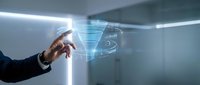 Businessman hand touching digital holographic interface with glowing data visualization and network connections in modern office environment for technology and innovation concepts.