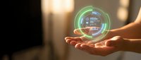 Hands holding glowing holographic circular interface with digital data display and futuristic technology controls for innovation and business solutions.