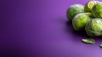 Fresh green Brussels sprouts on vibrant purple background with copy space for healthy cooking and nutrition concepts.