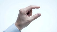 Male hand with light skin tone gesturing small size or measurement against white background, suitable for business, education, and design projects.