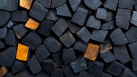Charred wooden blocks background with contrasting orange accents creating dramatic pattern. Dark charcoal texture of burnt wood pieces arranged in geometric layout.