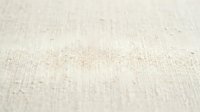 Neutral beige linen fabric texture with fine weave pattern, suitable for backgrounds, textile design, interior decoration, and fashion projects.