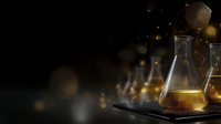 Laboratory glass flask with golden liquid on dark background with glowing particles and bokeh effects creating scientific research atmosphere.