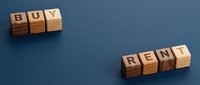 Buy or rent decision concept with wooden blocks on blue background, representing real estate choices and property investment options.