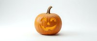 Carved Halloween pumpkin with glowing happy face isolated on white background for autumn holiday decorations and seasonal design projects.