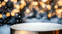 Wooden podium stage with golden bokeh lights and falling snow creating festive winter holiday atmosphere for product display and presentation backdrop.