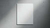 Blank white canvas or poster mockup hanging on concrete wall with dramatic lighting and shadows for art gallery exhibition or design presentation.