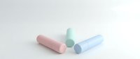 Three pastel cosmetic tubes in pink, mint, and blue arranged on a white surface, showcasing minimalist beauty packaging design.
