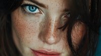 Close-up portrait of young Caucasian woman with striking blue eyes, natural freckles and brown hair. Authentic beauty concept for skincare campaigns.