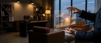 Businessman analyzing holographic financial data charts and graphs in modern office environment with city view background at evening.