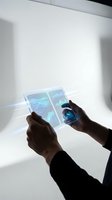 Hands of male professional in dark business attire holding transparent futuristic tablet with glowing blue digital interface and data visualization, isolated on white background for tech and innovation design use.