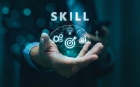 Professional businessman holding glowing skill development sphere with icons representing growth, target achievement and innovation in corporate environment.
