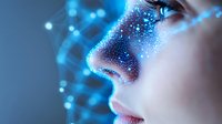 Close up profile view of woman's face with glowing blue particles and digital effects creating futuristic aesthetic against dark background, representing technology and innovation.