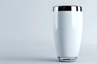Fresh glass of milk on light background, minimalist composition with copy space. Clean white beverage against soft gray backdrop creates modern aesthetic appeal.
