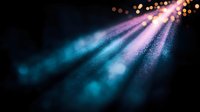 Colorful light beams with bokeh effects streaming through darkness creating magical atmosphere for presentations and digital backgrounds.