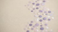 Purple and white confetti scattered on beige background for party celebration decoration and festive event design with copy space.