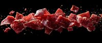Red gummy candies with sugar coating scattered and suspended in motion against black background, ideal for confectionery, food, and candy advertising projects.