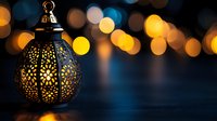 Decorative oriental lantern with glowing warm light against dark background with golden bokeh lights creating magical festive atmosphere.