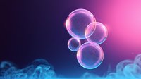 Glowing transparent spheres with luminescent effect floating in pink and blue gradient space surrounded by ethereal mist, suitable for abstract backgrounds.