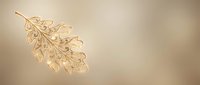 Elegant golden oak leaf with intricate ornamental details on warm beige background for luxury branding and sophisticated design projects.