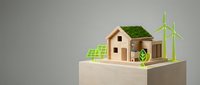 Eco-friendly wooden house model with solar panels, wind turbines and green roof on neutral background showcasing sustainable energy solutions.
